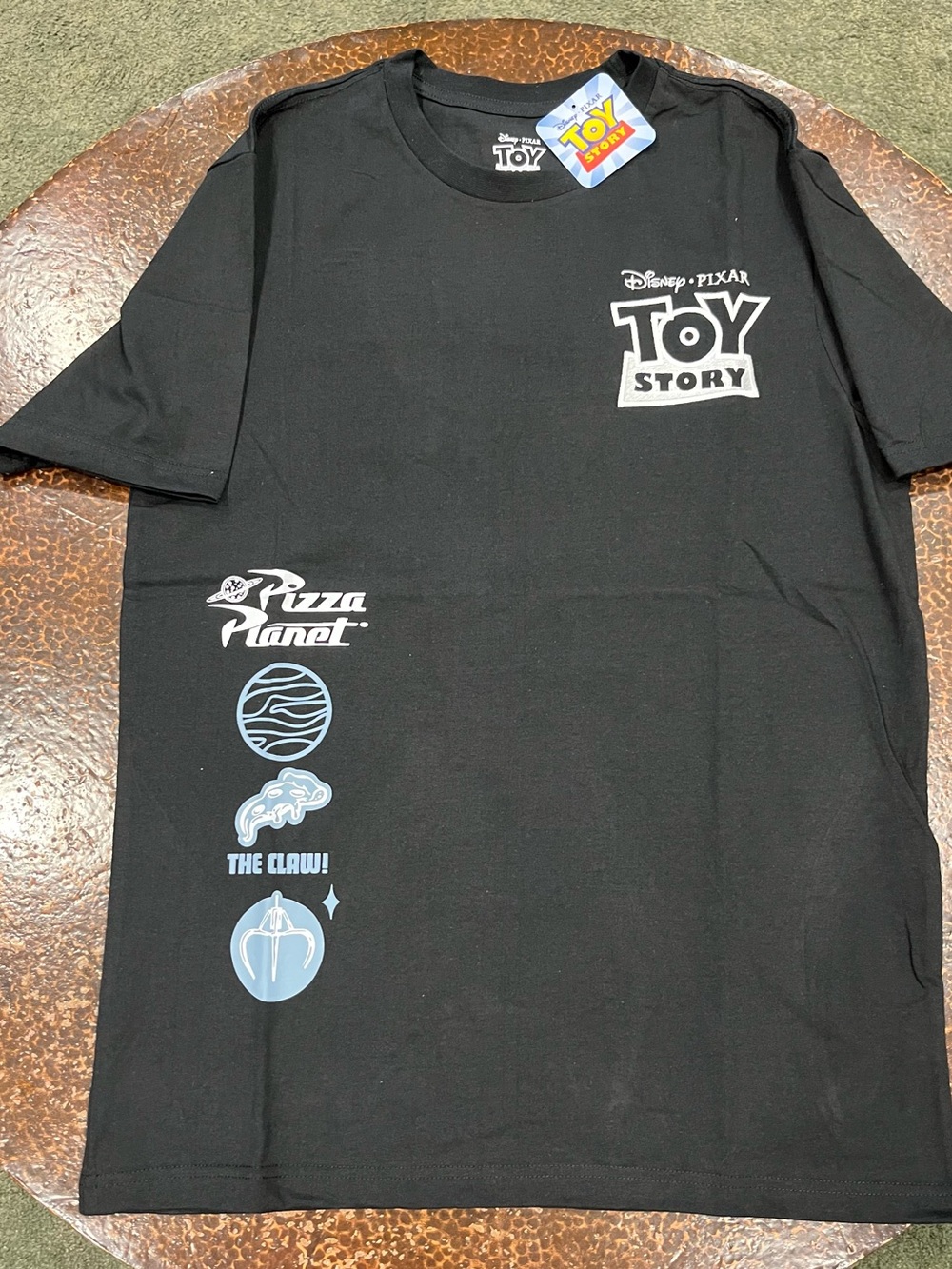 Toy Story Mens Black Pizza Planet Graphic T‑Shirt.